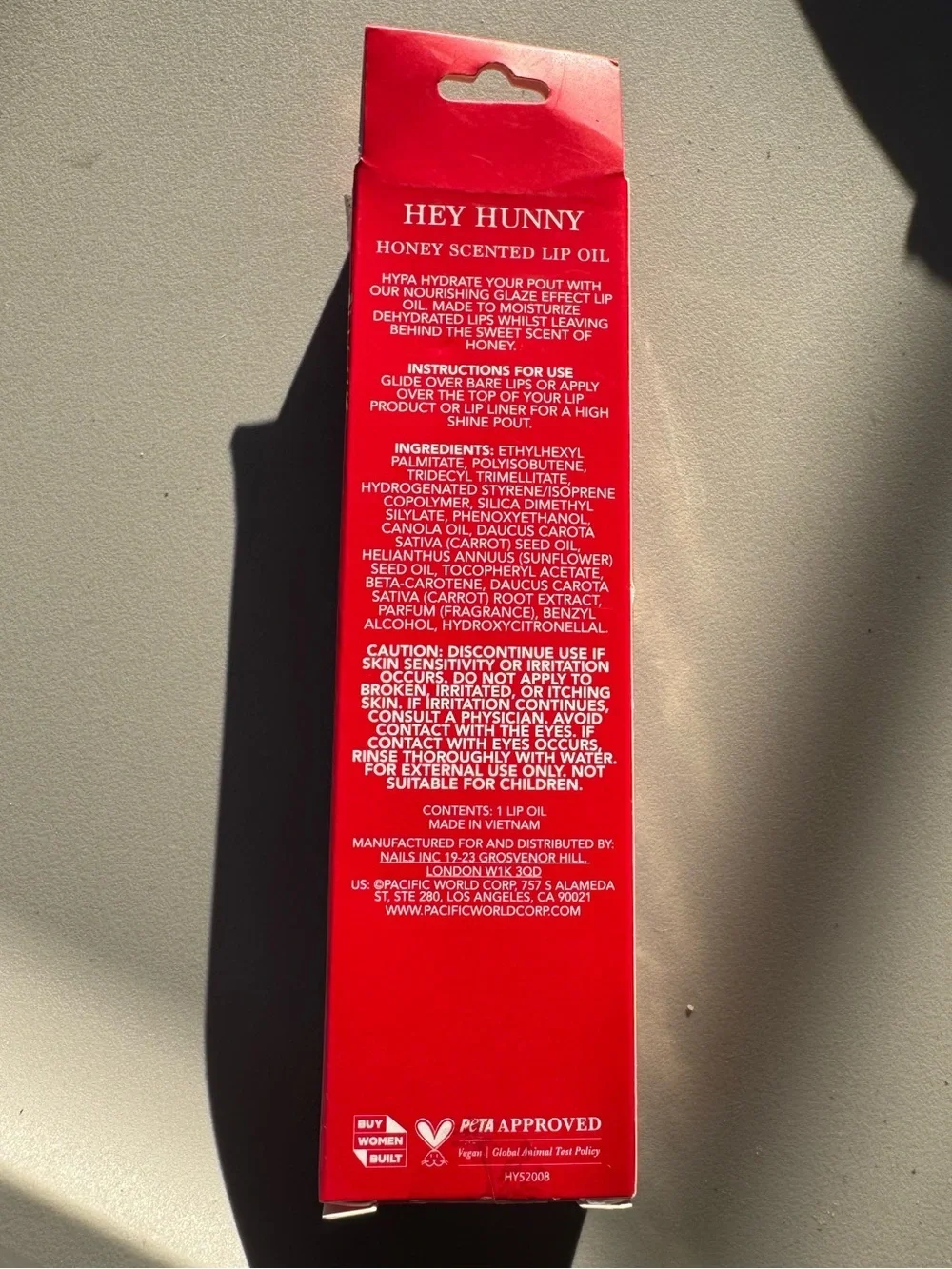 Holler and Glow Hypa Lip Oil in the honey scent
